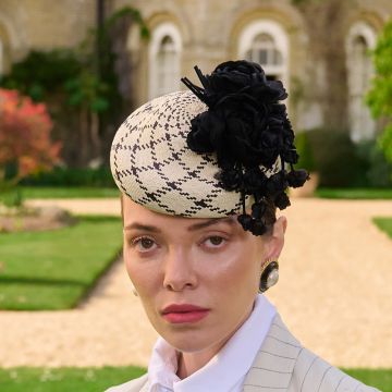 A V V Chapeaux Clotted Cream and Black Ecuadorian hand-woven percher hat with folded roses and petal drops.
