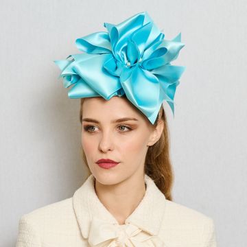 A V V Chapeaux Aquarian satin ribbon headpiece with oversized double bows and pearl centre.